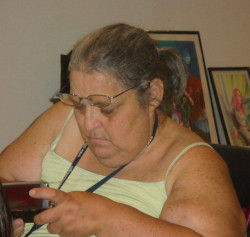 Edith looking at cell phone