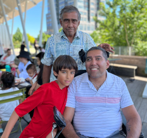 Jason DaSilva with his father and son